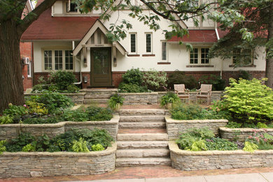 Photo of a mid-sized craftsman front yard brick garden path in Toronto.