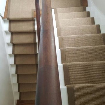 Brown Carpet with Brown Edgings Installed to Stairs