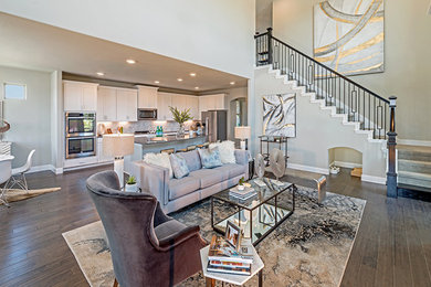 Family room - mid-sized modern open concept medium tone wood floor and brown floor family room idea in Dallas with gray walls, a standard fireplace, a tile fireplace and a wall-mounted tv