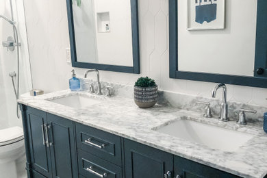 Mid-sized mid-century modern kids' white tile and porcelain tile cement tile floor, multicolored floor and double-sink bathroom photo in Miami with furniture-like cabinets, blue cabinets, a two-piece toilet, white walls, a drop-in sink, marble countertops, gray countertops and a freestanding vanity