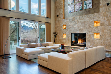This is an example of a mid-sized contemporary formal open concept living room in Denver with beige walls, dark hardwood floors, a standard fireplace, a tile fireplace surround and no tv.