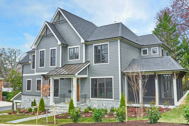 Example of a large transitional gray three-story concrete fiberboard exterior home design in DC Metro with a shingle roof