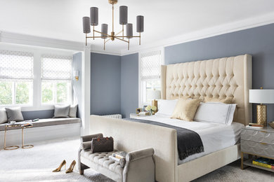 Inspiration for a large transitional master bedroom in New York with grey walls, carpet and beige floor.