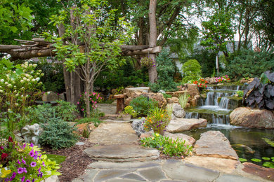 This is an example of a traditional backyard water fountain landscape in Chicago.