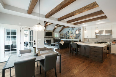 Inspiration for a contemporary l-shaped medium tone wood floor, brown floor and exposed beam open concept kitchen remodel in Chicago with recessed-panel cabinets, medium tone wood cabinets, quartz countertops, gray backsplash, an island and white countertops