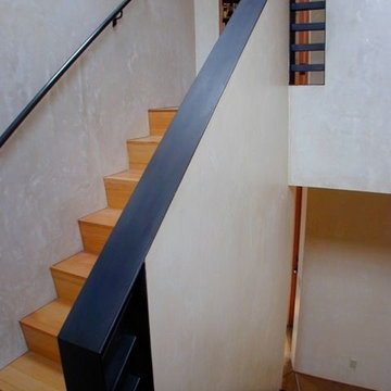 Stair treads and risers by John's Custom Floor; iron work by Albert Borges