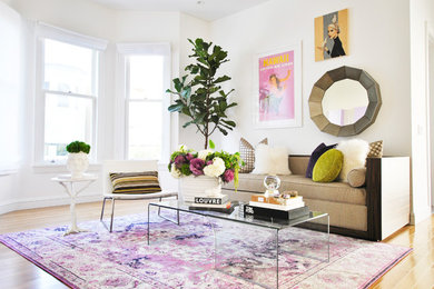 Mid-sized trendy enclosed medium tone wood floor and orange floor living room photo in San Francisco with white walls