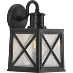 Progress Lighting - Seagrove Collection  1-Light Medium Wall Lantern with DURASHIELD - Capture the raw strength and captivating honesty of salty seashores with this coastal-inspired wall lantern. Clear seeded glass panes rest in a non-metallic, corrosion-resistant composite polymer with a rich black finish. An x-brace design adorns each side of the frame and adds an extra pinch of rustic character. DURASHIELD by Progress Lighting is built to last. Constructed from a composite material with UV protection, DURASHIELD holds up even in the harshest weather conditions. This high-performance finish has a 5-year warranty and is resistant to rust, corrosion, and fading.