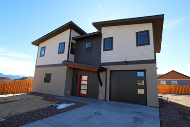 Mid-sized contemporary beige two-story mixed siding house exterior idea in Denver
