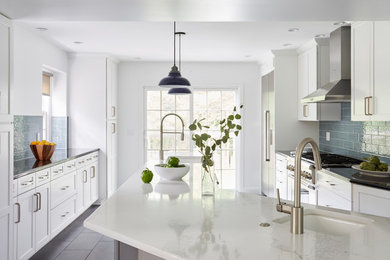 Kitchen - large transitional porcelain tile and gray floor kitchen idea in Philadelphia with white cabinets, quartz countertops, blue backsplash, glass tile backsplash, stainless steel appliances, an undermount sink and shaker cabinets