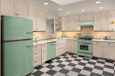 Enclosed kitchen - mid-sized transitional l-shaped multicolored floor and laminate floor enclosed kitchen idea in Seattle with a farmhouse sink, shaker cabinets, white cabinets, quartz countertops, yellow backsplash, colored appliances, no island, white countertops and ceramic backsplash