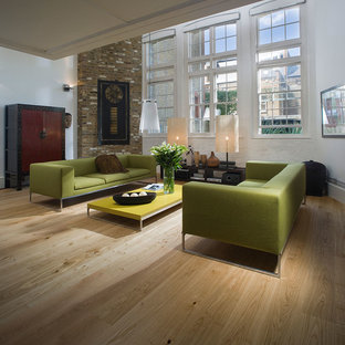 Inspiration for a mid-sized 1950s open concept light wood floor living room remodel in Chicago with white walls