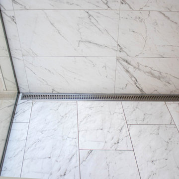 Luxurious White Bathroom with Barrier Free Shower, Make-up area and Storage