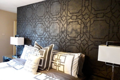 Inspiration for a large contemporary master medium tone wood floor bedroom remodel in Houston with black walls and no fireplace