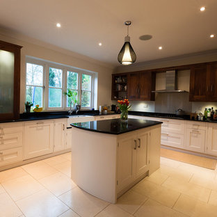 Large contemporary kitchen pantry appliance - Large trendy u-shaped porcelain floor kitchen pantry photo in Kent with a farmhouse sink, shaker cabinets, dark wood cabinets, granite countertops, stainless steel appliances and an island