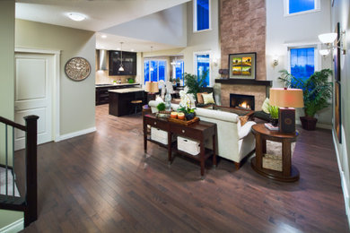 Inspiration for a large contemporary formal and open concept dark wood floor and brown floor living room remodel in Calgary with white walls, no tv, a standard fireplace and a tile fireplace