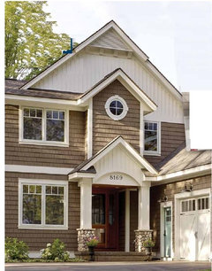 CEDAR SIDING OR SHAKES on new addition 2nd -brick first level