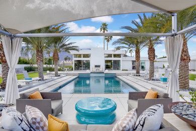 Mid-century modern pool photo in Other