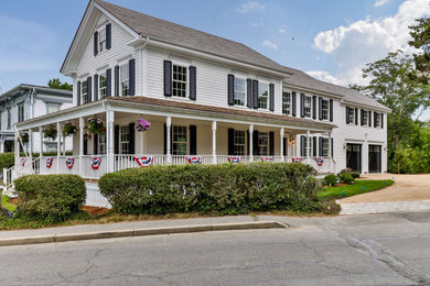 Coastal white exterior home idea in Boston with a shingle roof