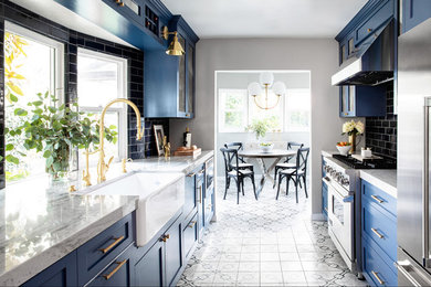 Kitchen - small modern galley cement tile floor and gray floor kitchen idea in San Diego with a farmhouse sink, shaker cabinets, blue cabinets, quartzite countertops, blue backsplash, ceramic backsplash, stainless steel appliances and gray countertops