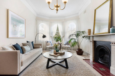 Photo of a victorian formal enclosed living room in Sydney with carpet, a standard fireplace and a stone fireplace surround.
