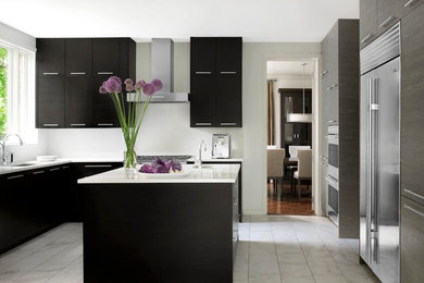 Inspiration for a mid-sized modern u-shaped marble floor eat-in kitchen remodel in St Louis with an undermount sink, flat-panel cabinets, quartz countertops, white backsplash, stone slab backsplash, stainless steel appliances, an island and black cabinets