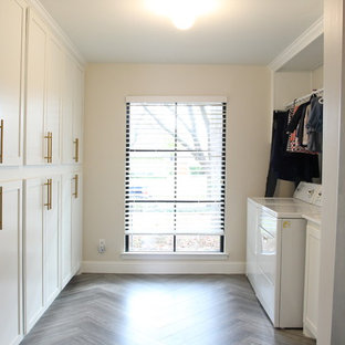 This is an example of a mid-sized modern kitchen pantry in Dallas with a single-bowl sink, shaker cabinets, white cabinets, white splashback, marble splashback, white appliances, ceramic floors, with island and grey floor.