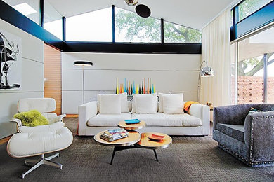 Inspiration for a large mid-century modern open concept carpeted and gray floor living room remodel in New Orleans with white walls
