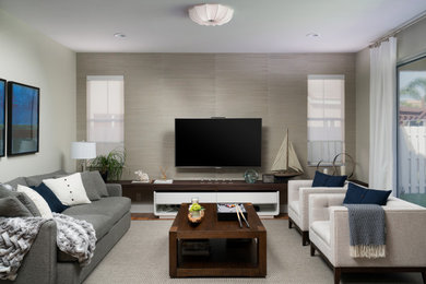 Transitional gray floor and wallpaper family room photo in Miami with gray walls and a media wall