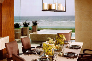 Example of an island style marble floor dining room design in Other with beige walls