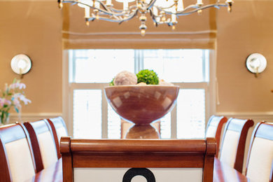 Inspiration for a mid-sized transitional light wood floor kitchen/dining room combo remodel in New York with beige walls