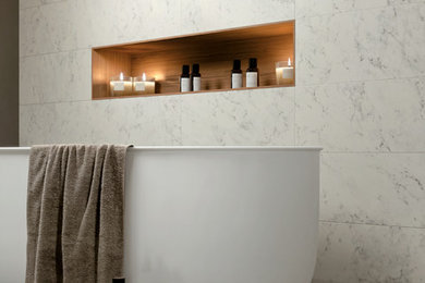 Design ideas for a traditional bathroom in Bologna with white tile, porcelain tile and porcelain floors.