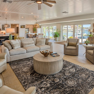 Spacious Modern Coastal Living Room with Natural Light and Water Views