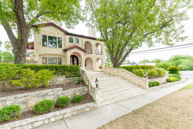 Example of a tuscan exterior home design in Austin