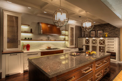 Kitchen - transitional medium tone wood floor kitchen idea in Cleveland with an undermount sink, white cabinets, quartz countertops, white backsplash, mosaic tile backsplash, paneled appliances and an island
