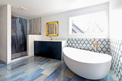 Large eclectic master blue tile and porcelain tile porcelain tile, blue floor and double-sink bathroom photo in Other with flat-panel cabinets, blue cabinets, white walls, marble countertops, white countertops and a built-in vanity