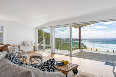 Inspiration for a beach style living room in Wollongong.
