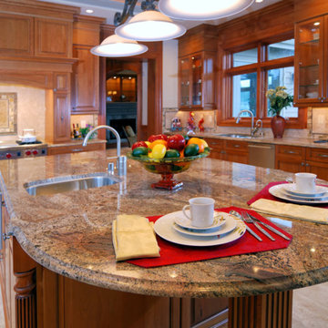 Juparana Colombo granite countertop with travertine back splashes