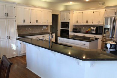 Example of a mid-sized southwest kitchen design in Kansas City
