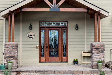 Mid-sized elegant concrete floor and multicolored floor entryway photo in Other with green walls and a glass front door