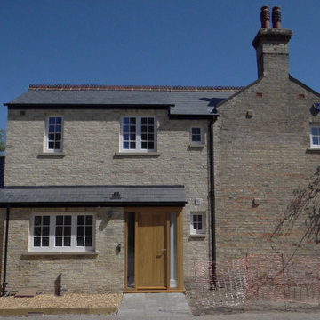 Contextural brick extensions to Cambridge Townhouse & newbuild Annex