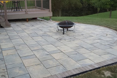 Design ideas for a large back patio in Other.