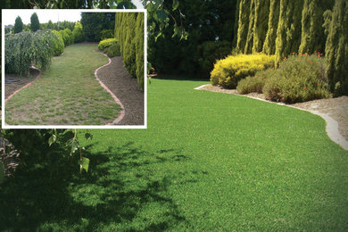 Inspiration for a mid-sized traditional full sun backyard landscaping in Austin.