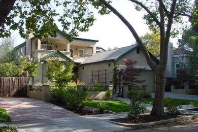 Example of a large transitional beige two-story stucco exterior home design in San Francisco with a shingle roof