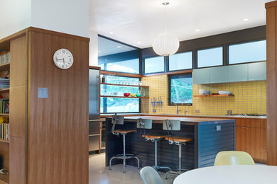 Example of a mid-sized mid-century modern kitchen design in Austin