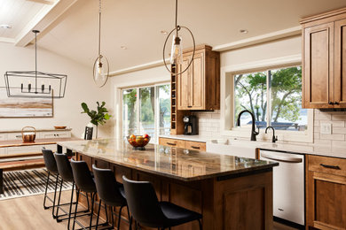 Inspiration for a large contemporary u-shaped medium tone wood floor eat-in kitchen remodel in Minneapolis with a farmhouse sink, recessed-panel cabinets, medium tone wood cabinets, quartzite countertops, beige backsplash, ceramic backsplash, stainless steel appliances, an island and brown countertops