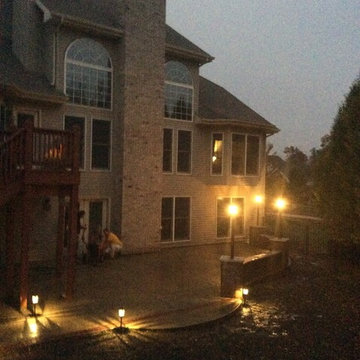 Finished Stamped concrete patio with stamped brick edge.