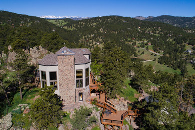 Example of a concrete fiberboard exterior home design in Denver