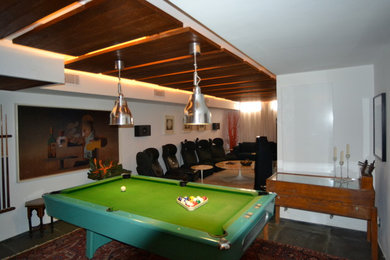 Inspiration for a mid-sized contemporary enclosed home theater remodel in Palma de Mallorca with a wall-mounted tv