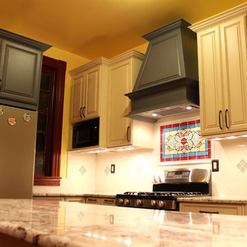 Traditional Galley Kitchen with Beige & Blue Cabinets and Chimney Hood